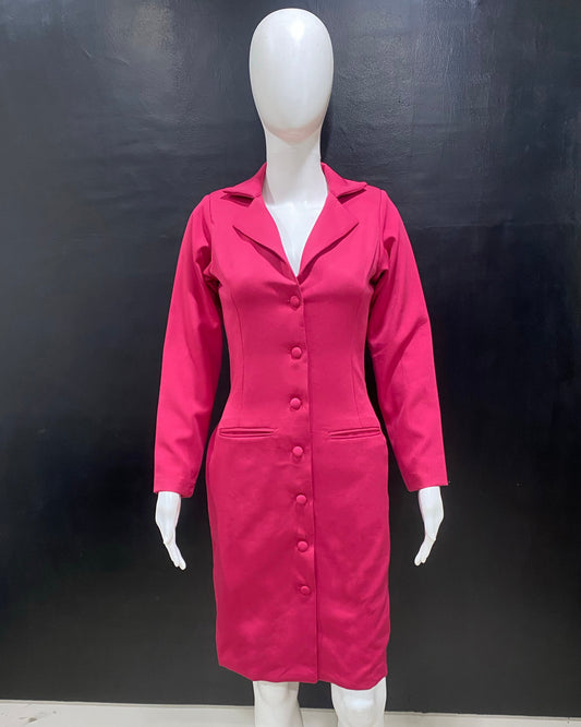 Mannequin wearing a pink dress against a black background