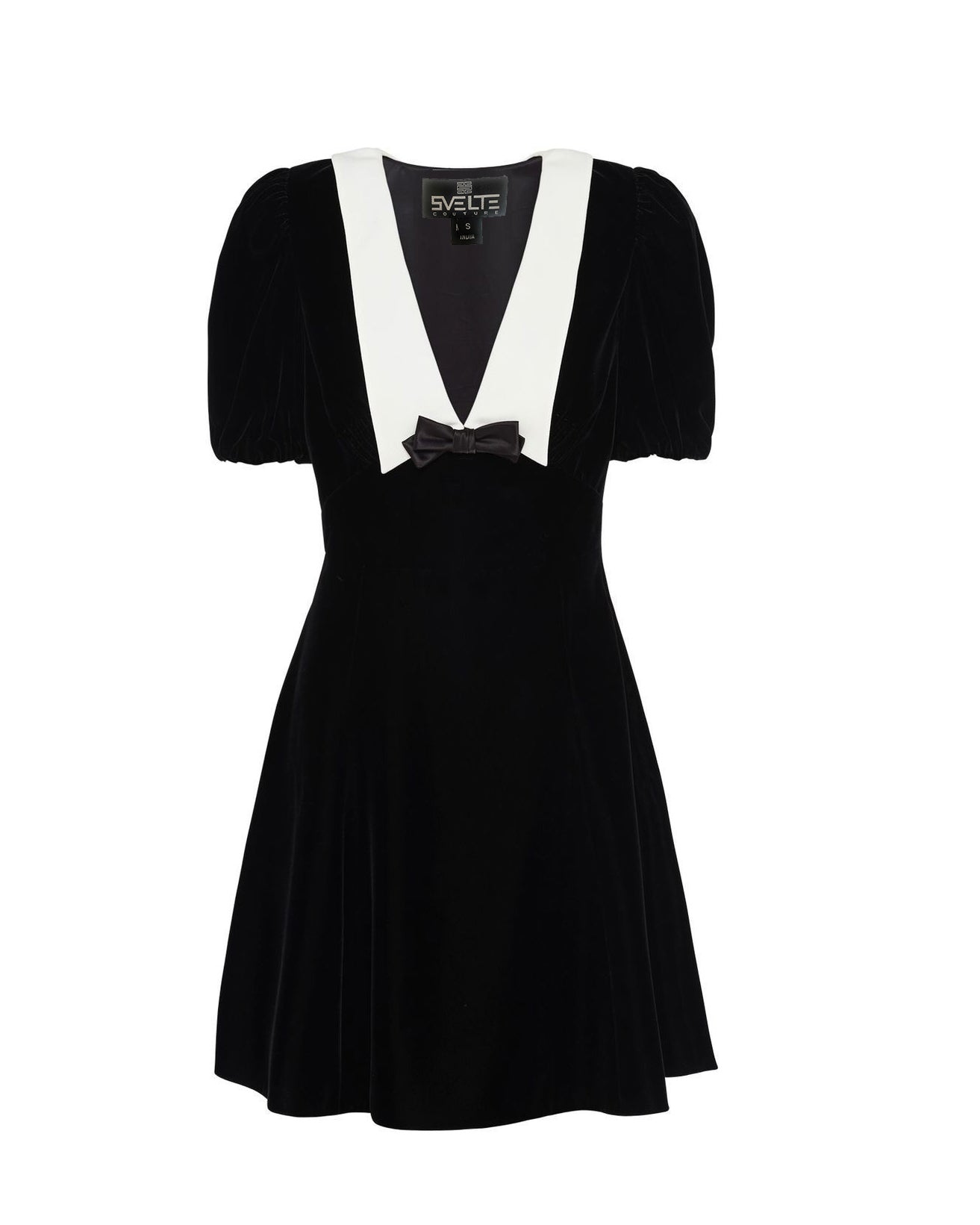 A black velvet dress with off-shoulder design and a bow detail on the shoulder.
