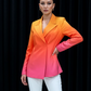 Woman wearing a gradient jacket from orange to pink against a black background