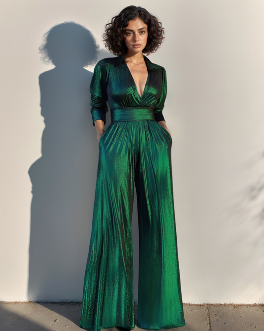 Woman wearing a green metallic jumpsuit against a plain background