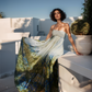 Woman in a strapless dress with a colorful skirt on a rooftop setting