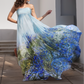 Woman wearing a strapless dress with floral design outdoors
