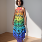 Model wearing a colorful dress with a gradient pattern in a minimal setting