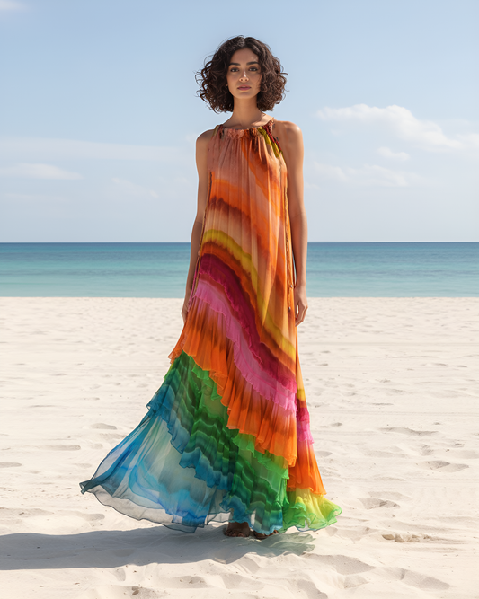 Woman wearing a colorful dress on a beach with ocean view